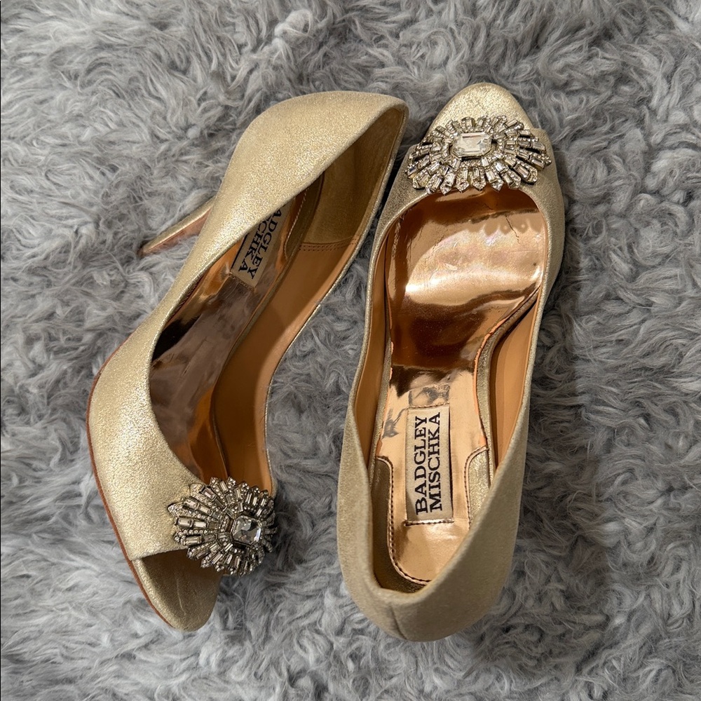 Beautiful gold metallic heels with a rhinestone embellishment